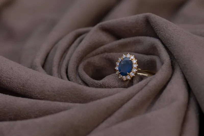 Gold ring with sapphire and diamond stones